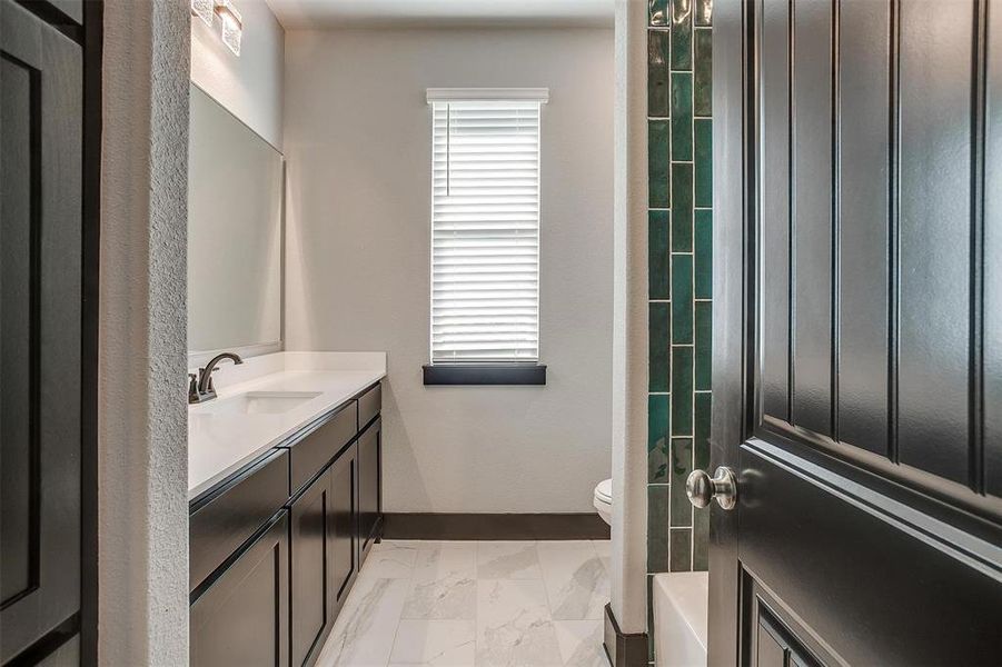 Bathroom with vanity and toilet