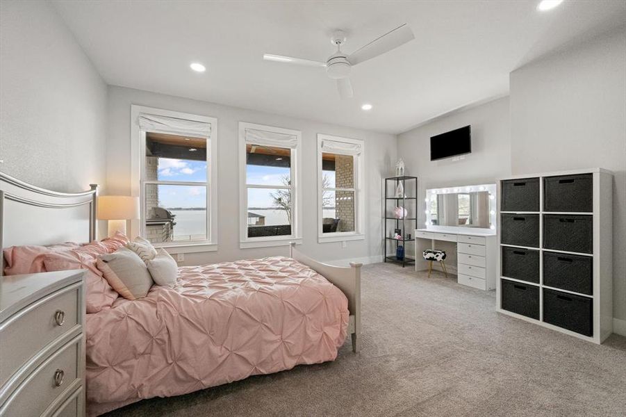 Carpeted bedroom with ceiling fan