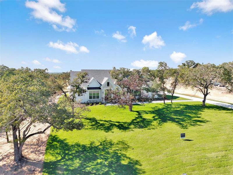 Front exterior of a new home in , Azle, TX, highlighting curb appeal (Image 22). Front exterior of a new home in , Azle, TX, highlighting curb appeal (Image 22).