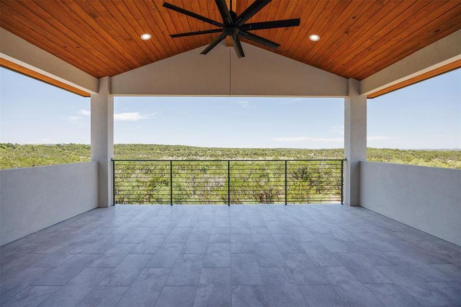 Bask in sweeping natural views of Lake Travis from this serene outdoor deck, perfect for relaxation and contemplation.