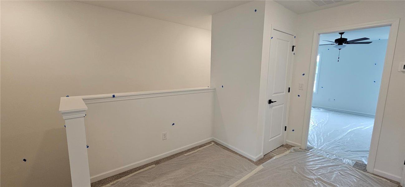 This interior hallway features a neutral palette,