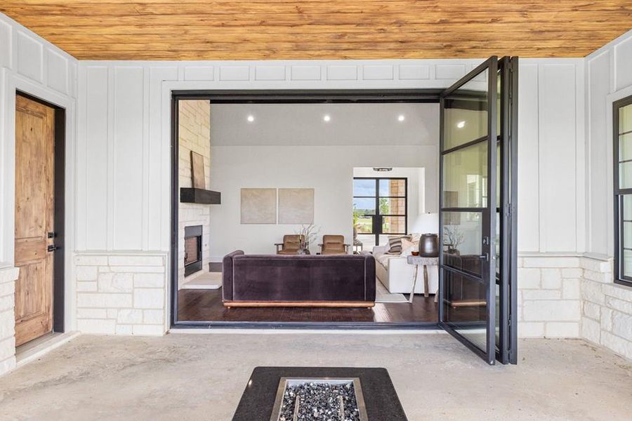 View from covered patio thru open folding-wall door that seamlessly connects indoor and outdoor spaces View from covered patio thru open folding-wall door that seamlessly connects indoor and outdoor spaces