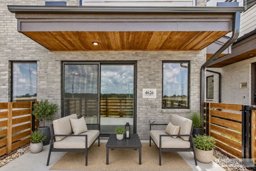 Exterior details and patio area of a home in Wildridge, Oak Point (Image 27).
