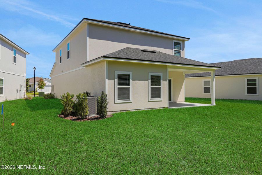Exterior details and patio area of a home in Amberly, Green Cove Springs (Image 4).