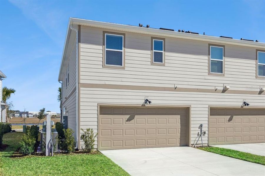 Front exterior of a new home in , Winter Garden, FL, highlighting curb appeal (Image 20).