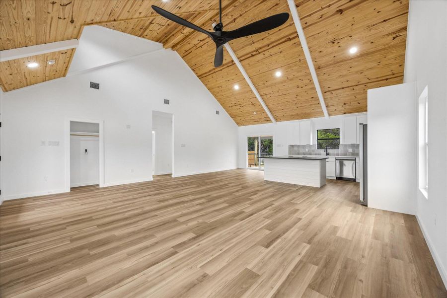 A spacious living area with vaulted wooden ceilings and contemporary finishes. A spacious living area with vaulted wooden ceilings and contemporary finishes.