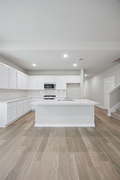 Kitchen in the Stanley II home plan by Trophy Signature Homes – REPRESENTATIVE PHOTO