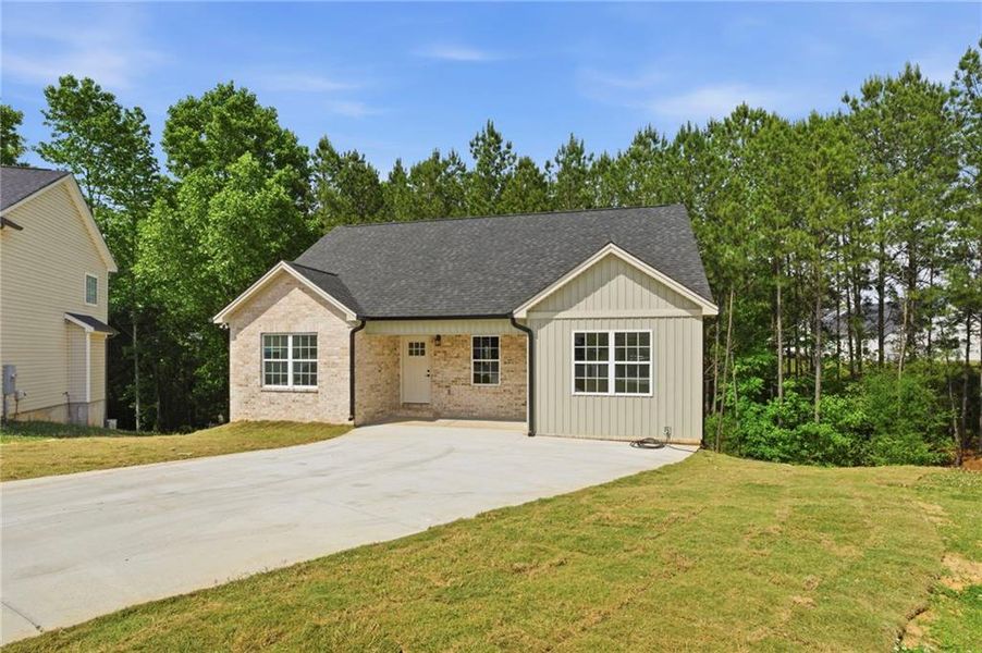 Front exterior of a new home in , Calhoun, GA, highlighting curb appeal (Image 27). Front exterior of a new home in , Calhoun, GA, highlighting curb appeal (Image 27).