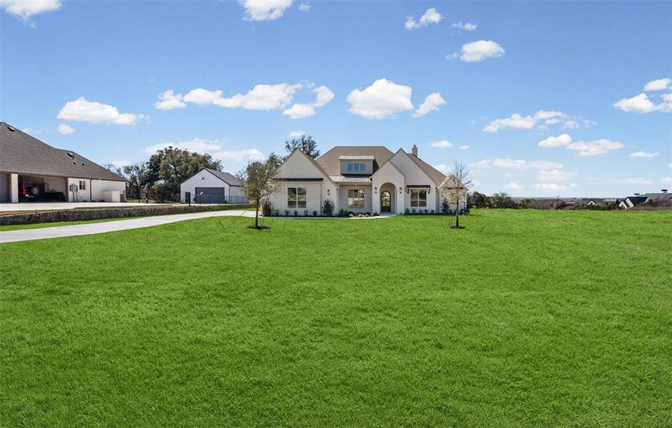 Front exterior of a new home in SouthBend Estates, Granbury, TX, highlighting curb appeal (Image 25).