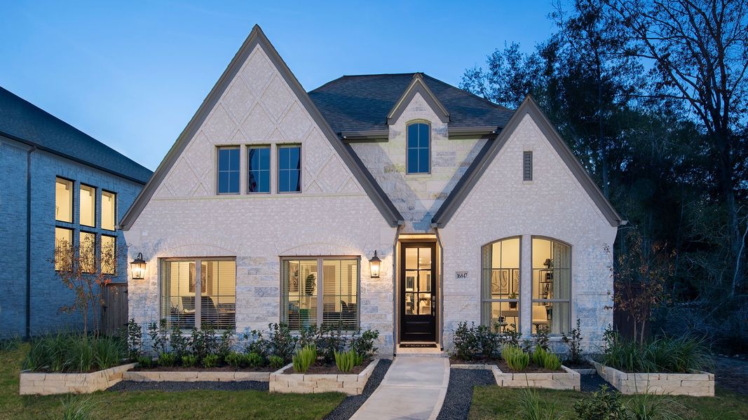 Front exterior of a new home in The Groves 45', Humble, TX, highlighting curb appeal (Image 1).