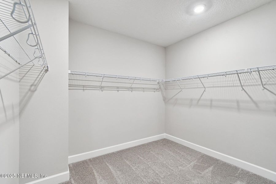 Spacious, unfurnished interior of a new home in Tributary 70', Yulee (Image 25).