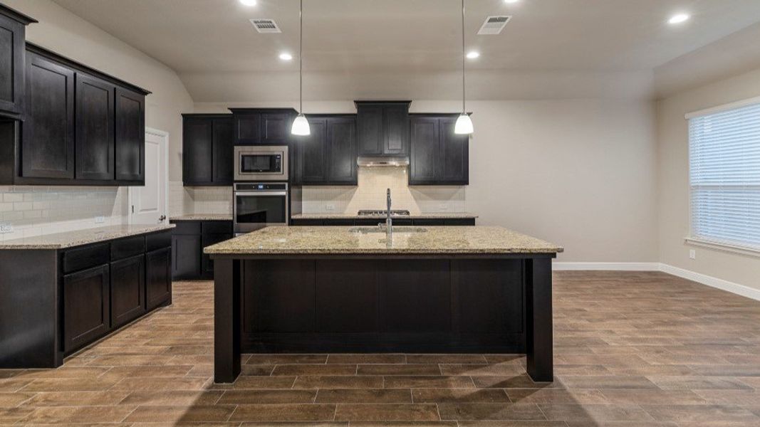 Representative furnished interior of a home built from the Guadalupe by D.R. Horton in Eden Ranch, Arlington (Image 9).