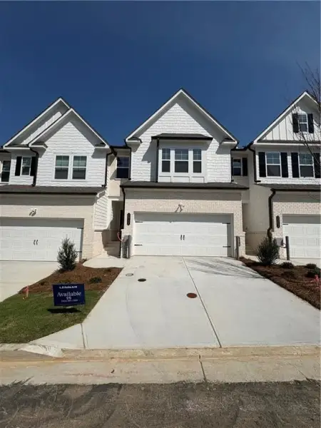 Front exterior of a new home in , Doraville, GA, highlighting curb appeal (Image 1). Front exterior of a new home in , Doraville, GA, highlighting curb appeal (Image 1).
