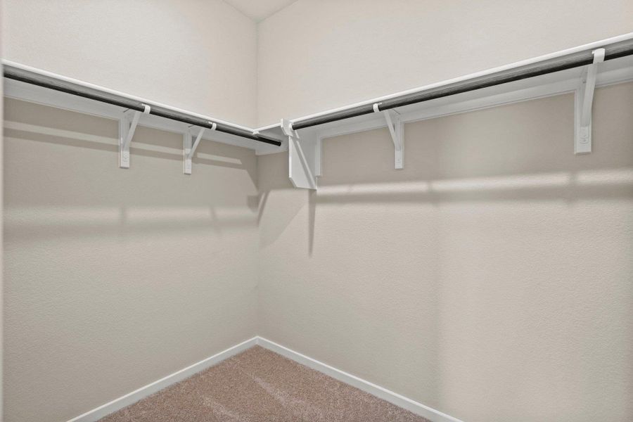 Walk-in closet in Primary Bedroom Walk-in closet in Primary Bedroom