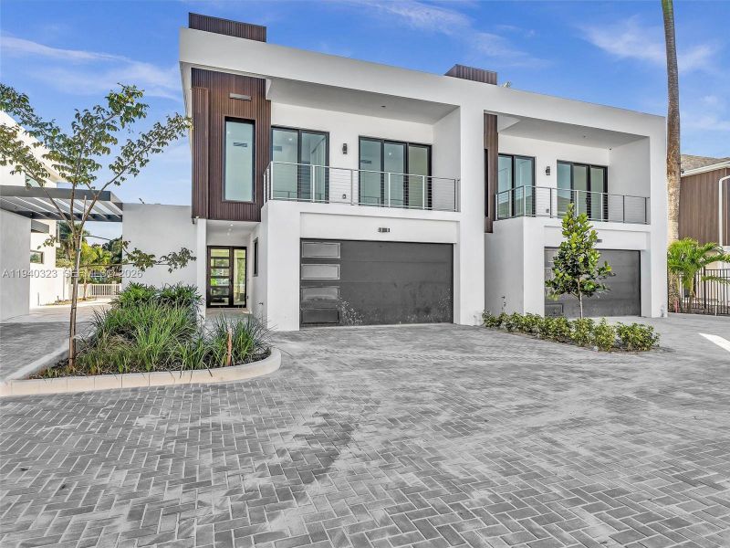 Front exterior of a new home in , Dania Beach, FL, highlighting curb appeal (Image 36).