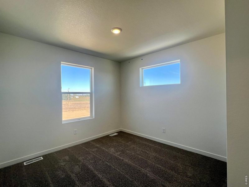 Spacious, unfurnished interior of a new home in Union Colony West, Greeley (Image 12).