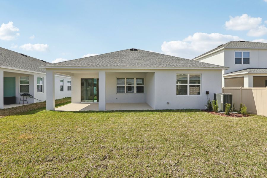 Exterior details and patio area of a home in St. Johns Preserve, Palm Bay (Image 3).