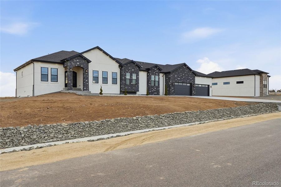 Front exterior of a new home in , Brighton, CO, highlighting curb appeal (Image 29).