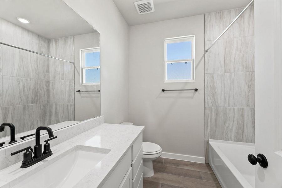 Representative furnished interior of a home built from the Tularosa by Hakes Brothers in Hickory Ridge, Elmendorf (Image 5).