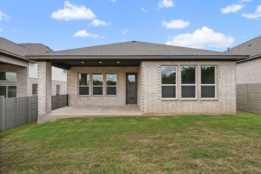 Exterior details and patio area of a home in Arbor Collection At Wolf Ranch, Georgetown (Image 25).