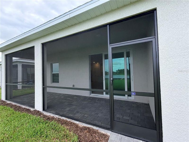Exterior details and patio area of a home in Island Lakes at Coco Bay, Englewood (Image 2).