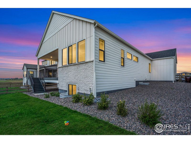 Front exterior of a new home in , Timnath, CO, highlighting curb appeal (Image 21).