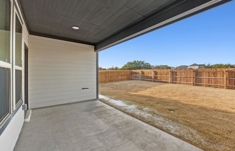 Exterior details and patio area of a home in Saddleback at Santa Rita Ranch, Liberty Hill (Image 24). Exterior details and patio area of a home in Saddleback at Santa Rita Ranch, Liberty Hill (Image 24).