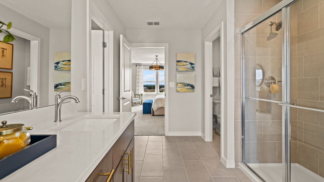 Primary Suite en suite Bathroom in the Model Highbourne by DRB Homes in Hamilton Bluff located in Haines City, FL. Primary Suite en suite Bathroom in the Model Highbourne by DRB Homes in Hamilton Bluff located in Haines City, FL.