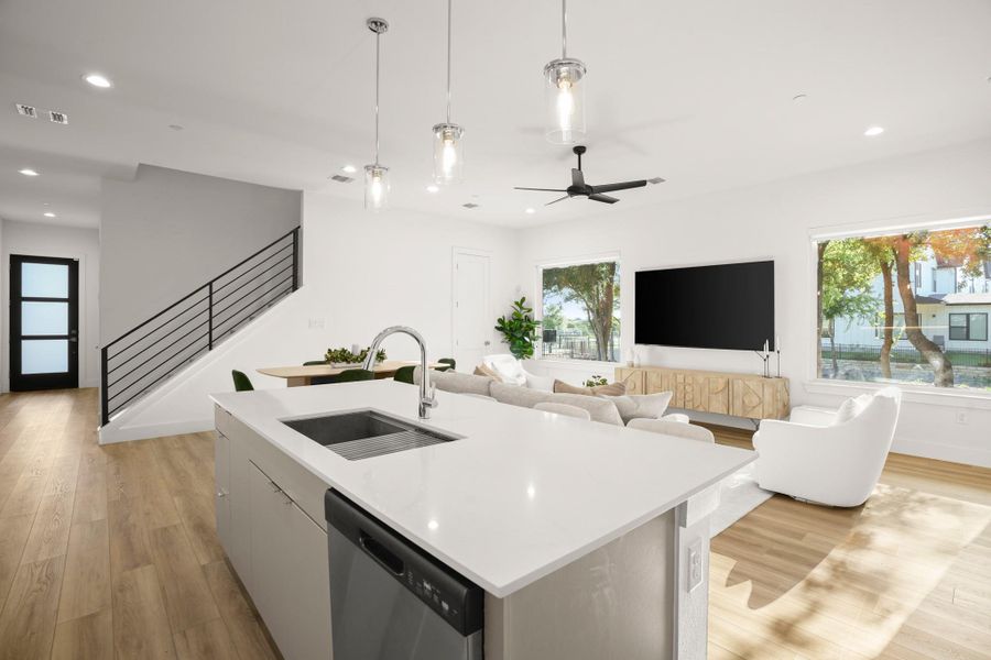 The island overlooks the living and dining areas making it easy for the home chef to stay connected and entertain. The island overlooks the living and dining areas making it easy for the home chef to stay connected and entertain.