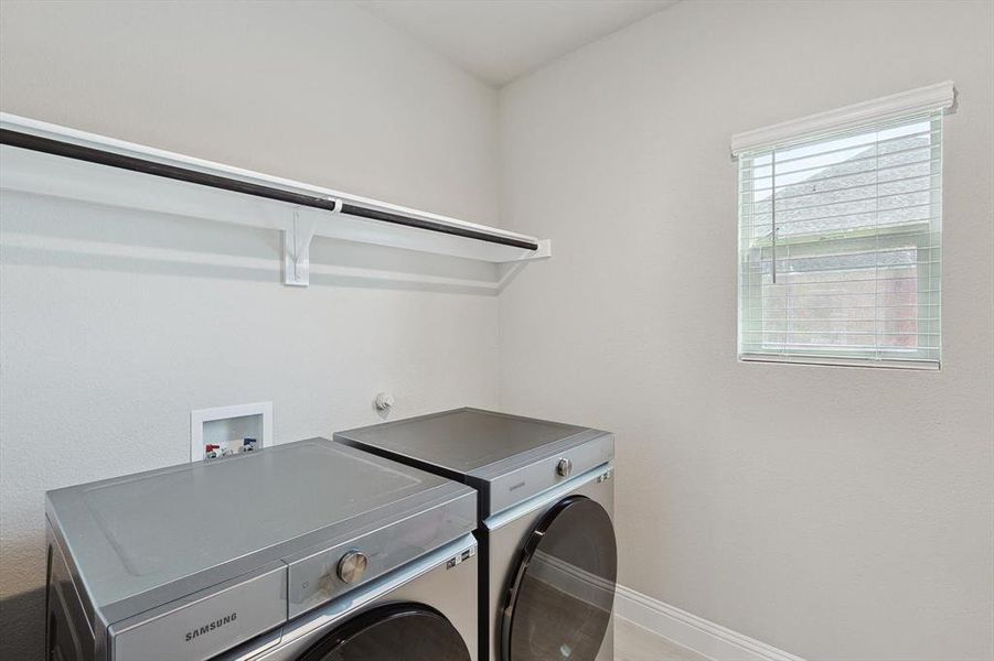 Clothes washing area with washing machine and dryer and washer hookup