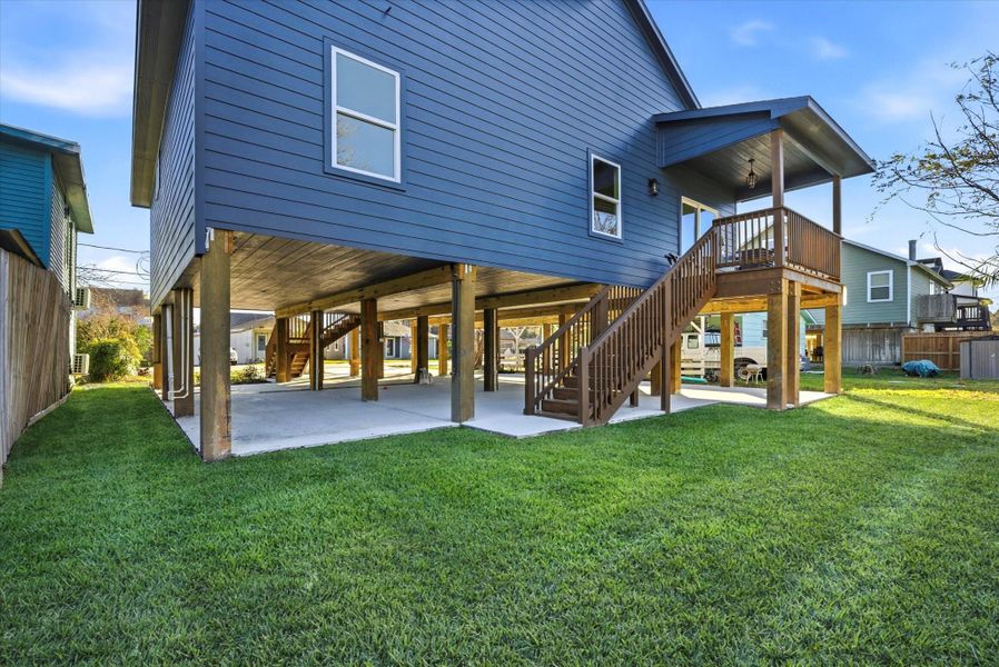 A covered patio anchors the backyard, complemented by just the right amount of green space for kids or furry friends to enjoy. A covered patio anchors the backyard, complemented by just the right amount of green space for kids or furry friends to enjoy.