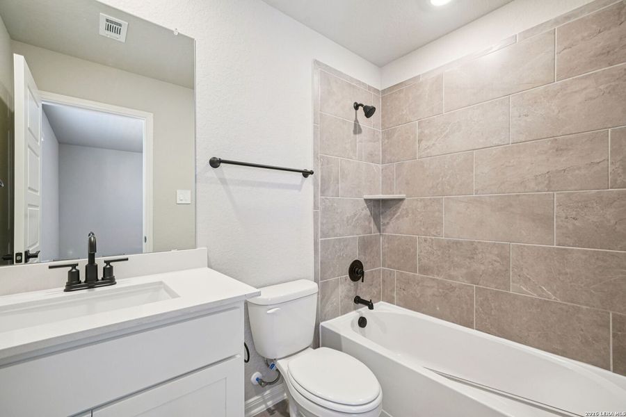 Furnished interior view inside a new home in Estancia Ranch - Classic Series, San Antonio (Image 16).