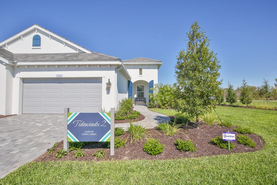 Representative exterior photo of a completed home built from the Tidewinds 2 by Neal Communities in Palm Grove, Bradenton, FL (Image 1). Representative exterior photo of a completed home built from the Tidewinds 2 by Neal Communities in Palm Grove, Bradenton, FL (Image 1).
