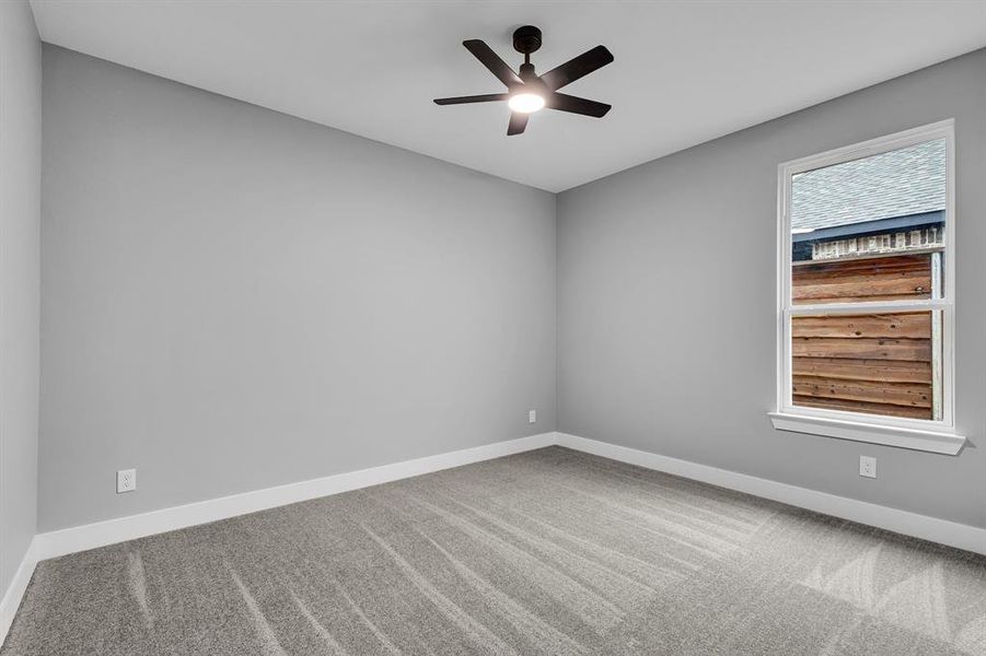 Unfurnished room with carpet flooring and ceiling fan