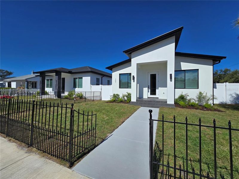 Front exterior of a new home in , St. Petersburg, FL, highlighting curb appeal (Image 1). Front exterior of a new home in , St. Petersburg, FL, highlighting curb appeal (Image 1).