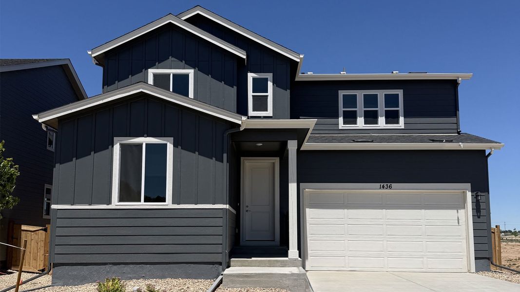 Front exterior of a new home in Trevenna, Windsor, CO, highlighting curb appeal (Image 1). Front exterior of a new home in Trevenna, Windsor, CO, highlighting curb appeal (Image 1).