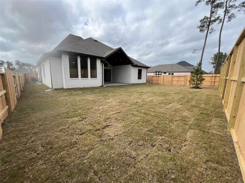 Exterior details and patio area of a home in Evergreen, Conroe (Image 19).