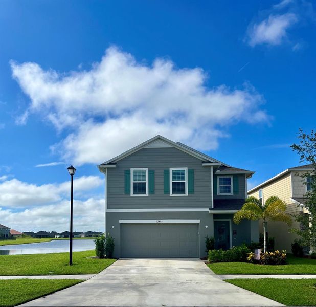 Front exterior of a new home in , Port St. Lucie, FL, highlighting curb appeal (Image 27).