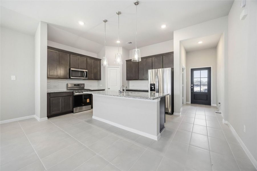Furnished interior view inside a new home in Sunterra, Katy (Image 5).