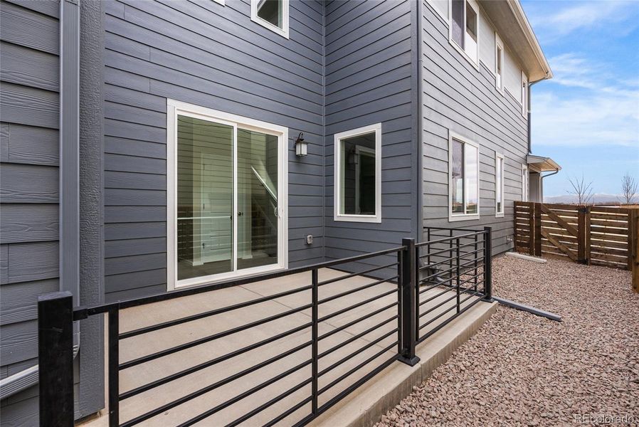 Exterior details and patio area of a home in Barefoot Village, Firestone (Image 19).