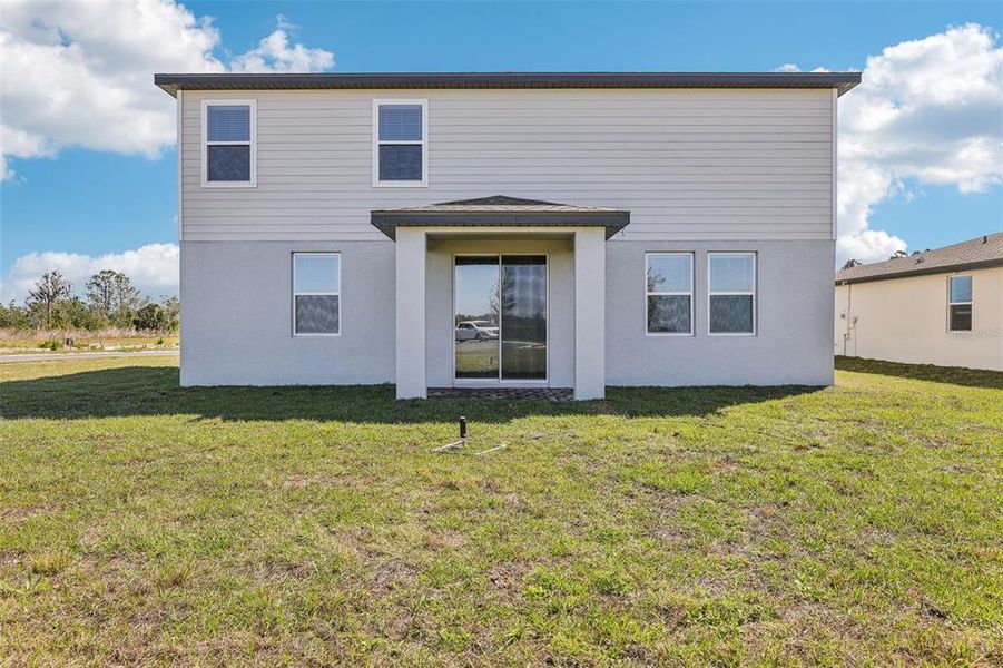 Exterior details and patio area of a home in Lake Deer Estates - Signature Series, Poinciana (Image 26). Exterior details and patio area of a home in Lake Deer Estates - Signature Series, Poinciana (Image 26).