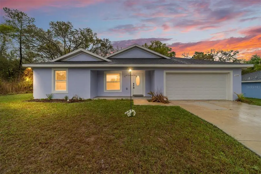 Front exterior of a new home in , Dunnellon, FL, highlighting curb appeal (Image 1). Front exterior of a new home in , Dunnellon, FL, highlighting curb appeal (Image 1).