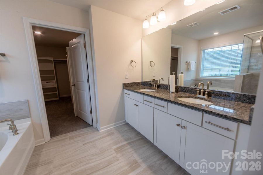 Primary bathroom with dual sinks.
