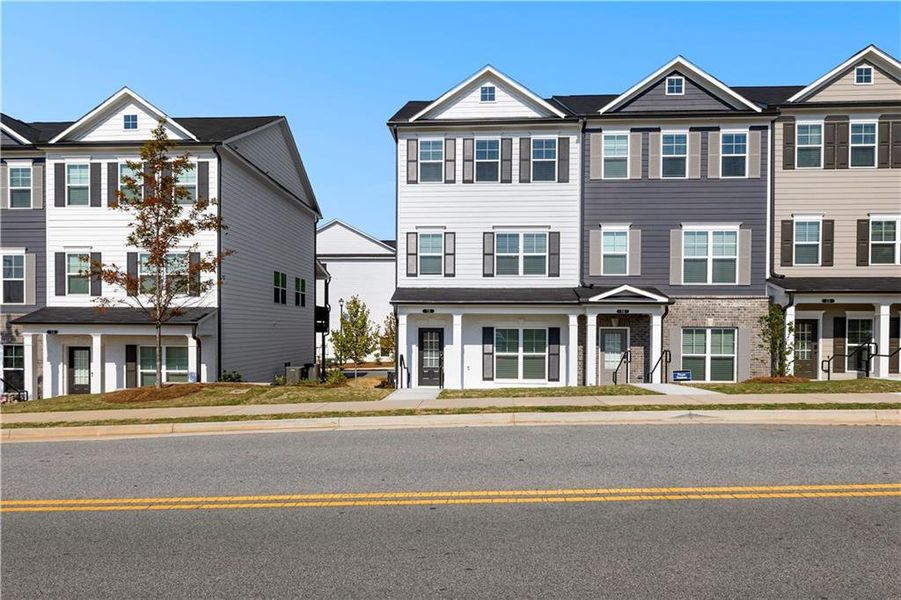 Front exterior of a new home in Nickel Creek at Newnan Crossing, Newnan, GA, highlighting curb appeal (Image 1). Front exterior of a new home in Nickel Creek at Newnan Crossing, Newnan, GA, highlighting curb appeal (Image 1).