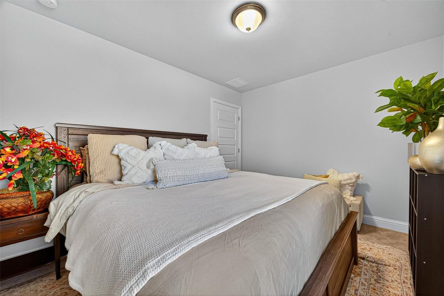 Furnished interior view inside a new home in Sunterra, Katy (Image 27).