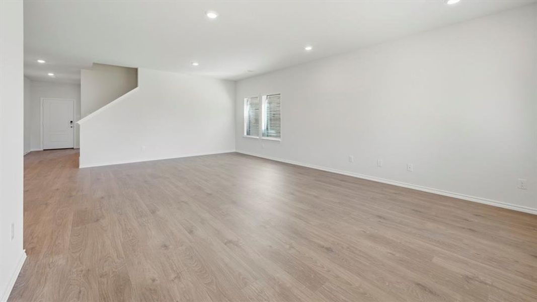 Unfurnished room with recessed lighting and light wood finished floors