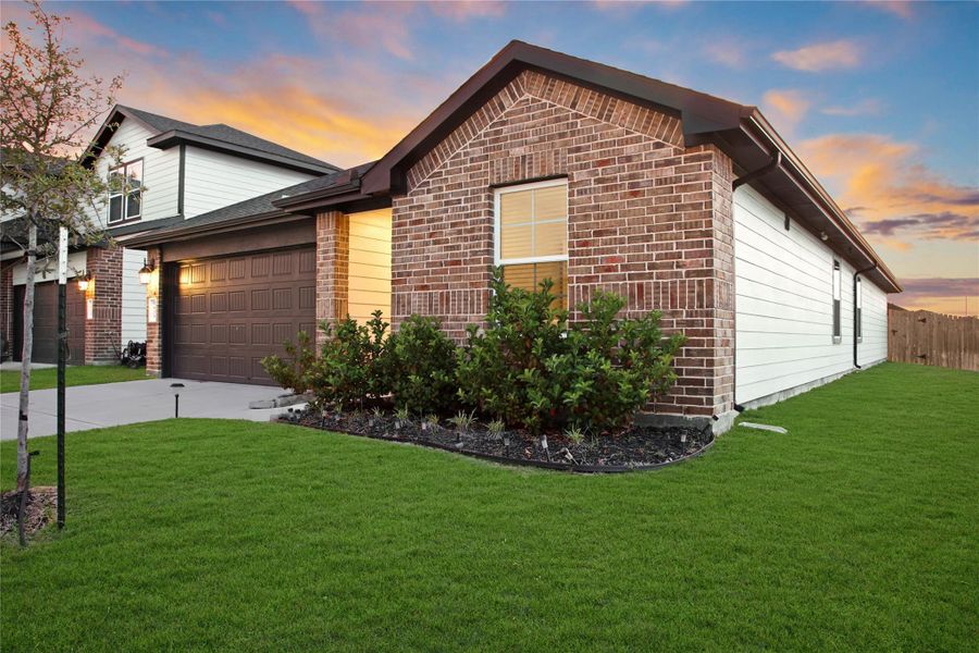 Front exterior of a new home in Sorrento, Richmond, TX, highlighting curb appeal (Image 27).