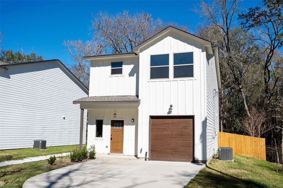 Front exterior of a new home in , Conroe, TX, highlighting curb appeal (Image 27).