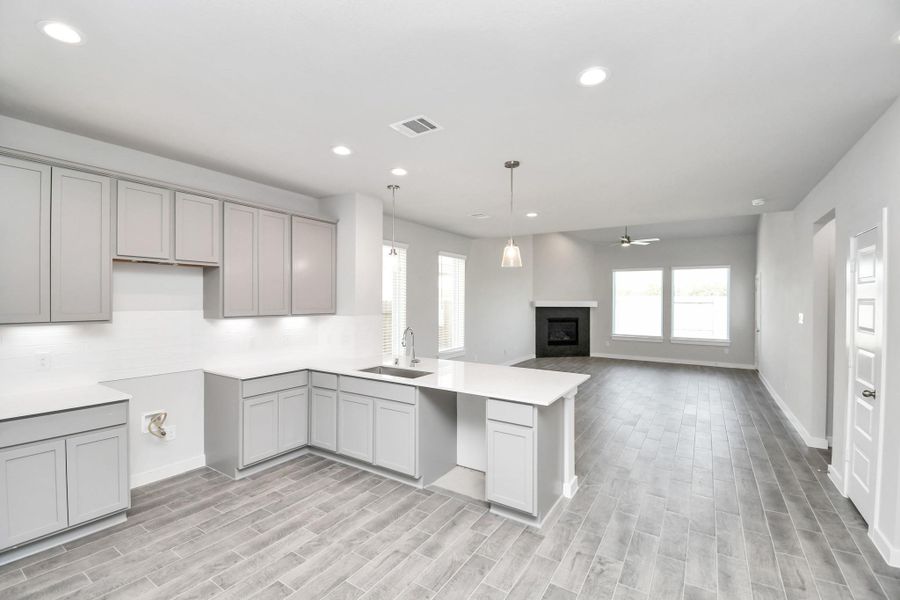 The extended counter area adds both practicality and style, making meal preparation a breeze. Every detail is thoughtfully designed to enhance the kitchen's functionality and aesthetic appeal. The extended counter area adds both practicality and style, making meal preparation a breeze. Every detail is thoughtfully designed to enhance the kitchen's functionality and aesthetic appeal.