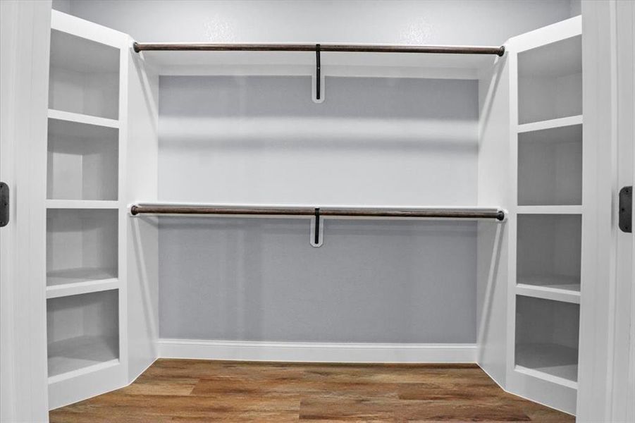 Spacious closet featuring wood-type flooring